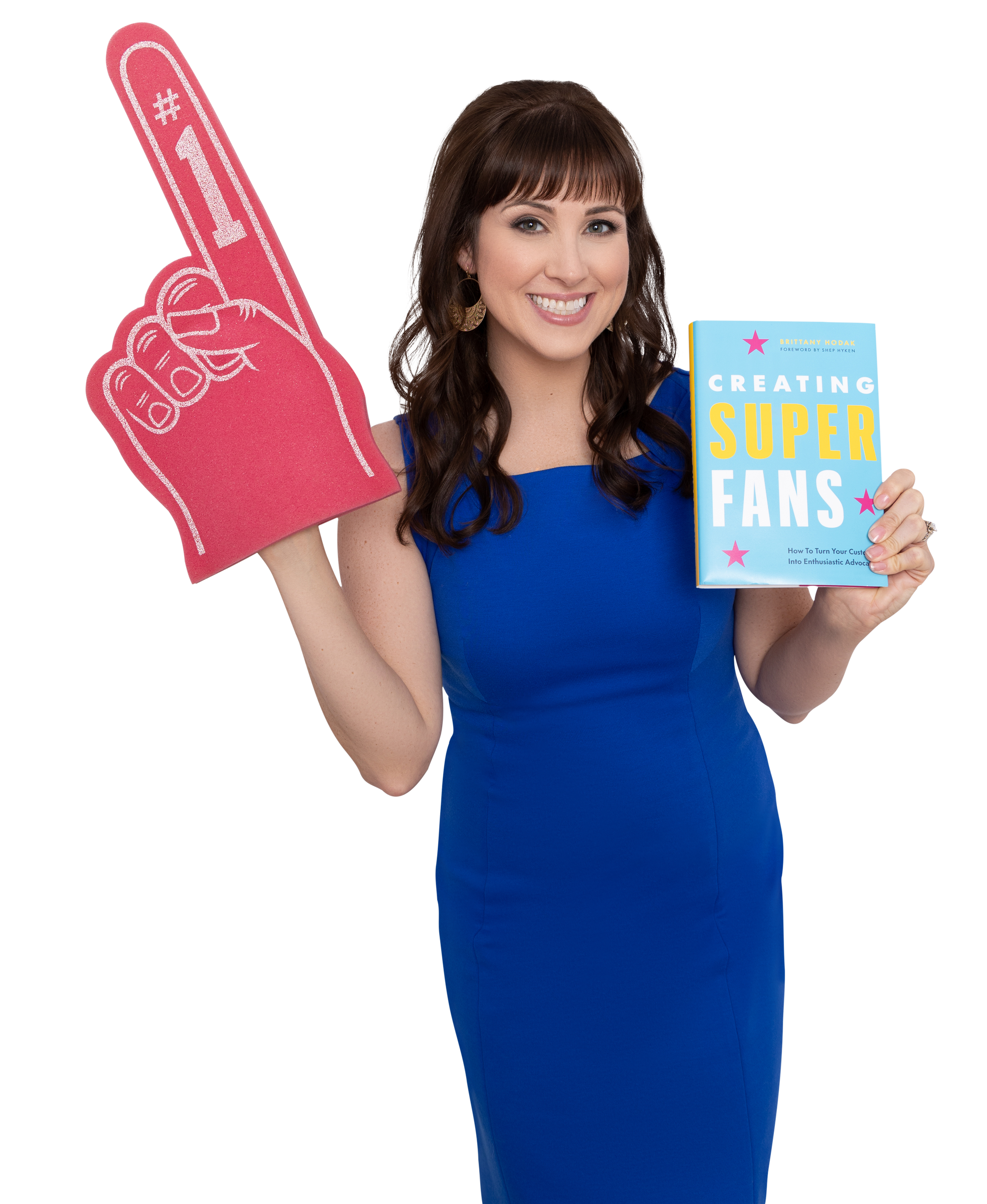 Brittany Hodak posing with pink foam finger and hard cover of Creating Superfans