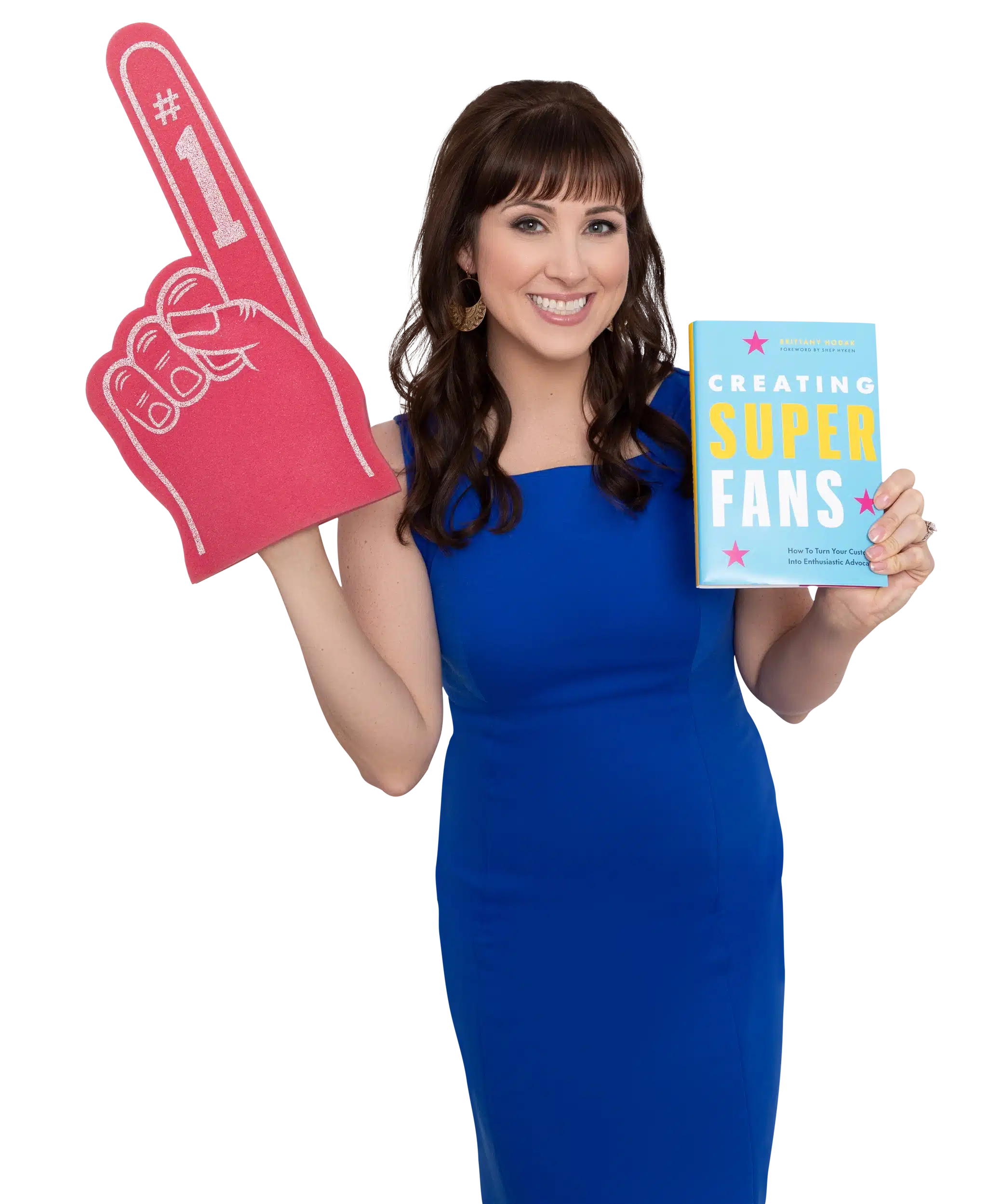 Brittany Hodak posing with pink foam finger and Creating superfans hardcover book - Motivational and Customer Experience Keynote Speaker