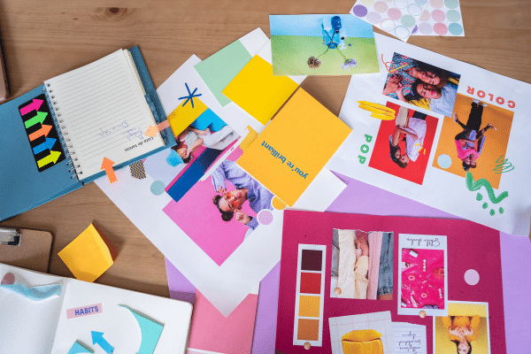 New Year, Same Brand? Why Consistency is Key (But Not Enough). Brand strategy session with post-it notes and printed out images and notes.