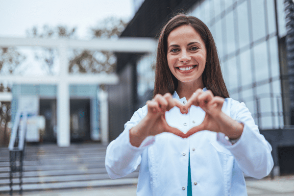 Customer making a heart shape with her hands